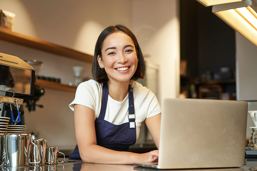 Enthusiastic Asian Girl In Cafe Uniform, Barista Worker With Lap
