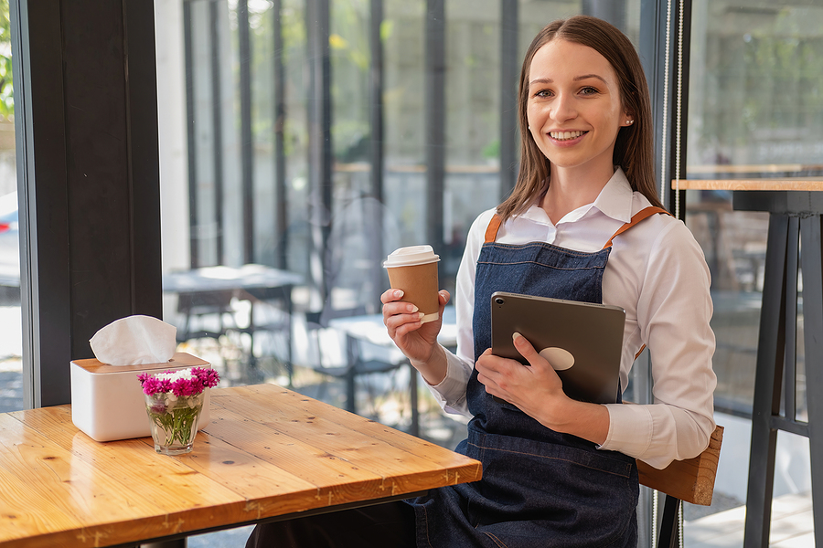 Portrait Of A Woman, A Coffee Shop Business Owner Smiling Beauti